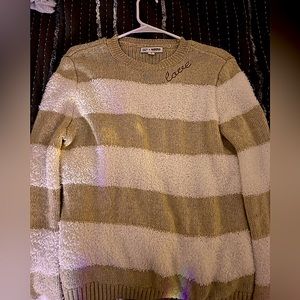 Women’s sweater with the word “love” at top in cursive and red. Size 4